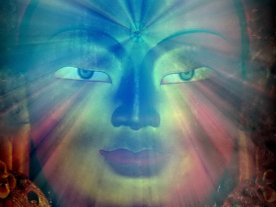 Transparent rainbow image of a Buddha's face.
