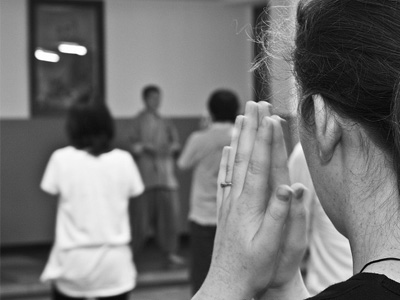 Lay person teaching meditation class.