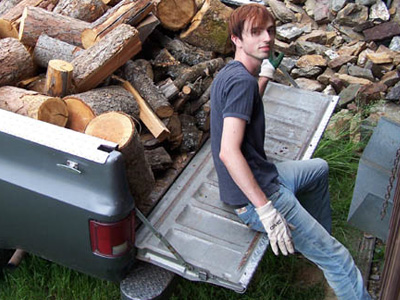 Karma unloading next winter's firewood from the Abbey truck.