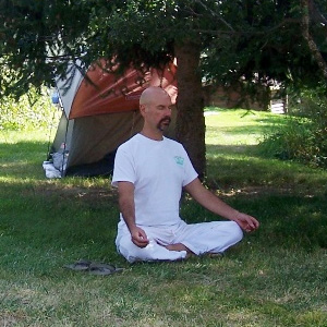Tom meditating outside at the Abbey.