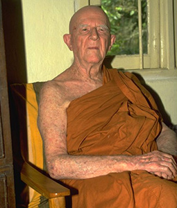 Bhante Nyanaponika sitting in a chair.