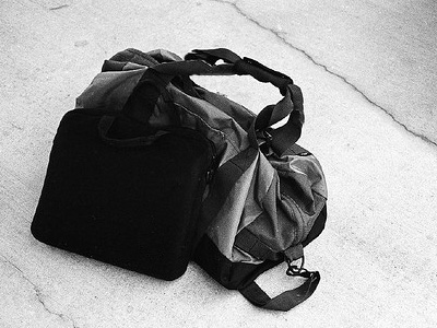 Duffel bag sitting on the ground.