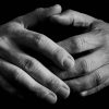 Hands held as if in contemplation.