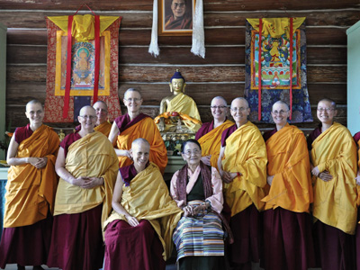 Abbey monastics with H.E. Dagmo-la in the meditation hall.