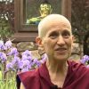 Venerable giving a talk in front of the Buddha statue at Sravasti Abbey.
