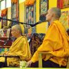 Ven. Tenpa translating for Ven. Chodron at a teaching in Russia.