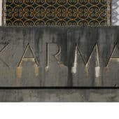 The word 'Karma' carved in stone.