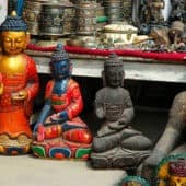 Four small Buddha statues.