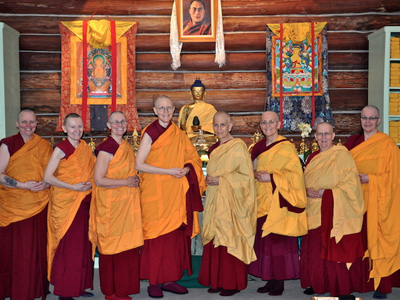 The current 10 Abbey monastics, standing together in the meditation hall.