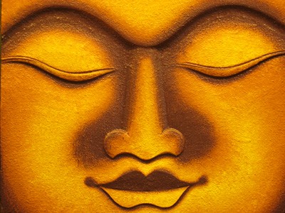 The golden face of the Buddha.