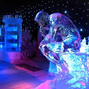 Ice sculpture of a man in thinking position.