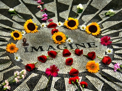 A peace sign made of flowers over the 'Imagine' John Lennon memorial in Central Park.