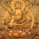 A copper-plate picture of a sitting Buddha.