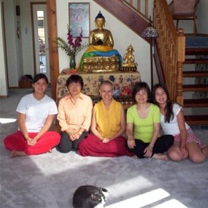 Venerable Chodron with Abbey guests and the cat, Manjushri.