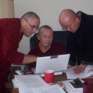 Venerable Heng-Ching Shih, Venerable Lekshe Tsomo and Venerable Jampa Tsedroen doing research together with a laptop.