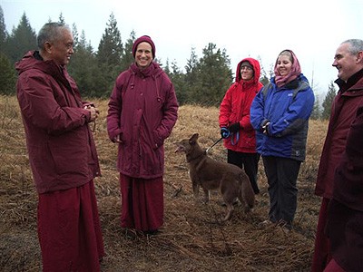 Venerable Thubten Chodron, Lama Zopa with retreatants standing and talking.
