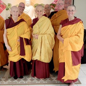 Venerables Chodron and Chonyi standing with a group of other bhikshunis.