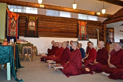 Abbey monastics chanting during a Medicine Buddha puja.