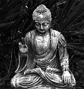 Black and white image of a Buddha statue.