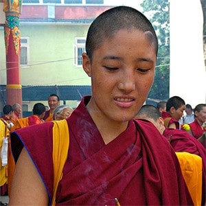 Tibetan nun smiling.