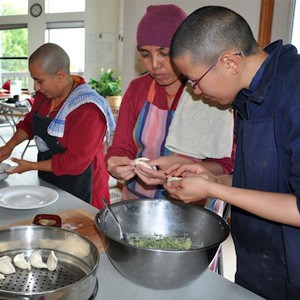 Venerable Damcho and visiting nuns, cooking.