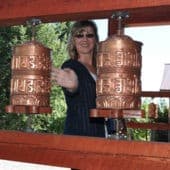 Guest at the Abbey, turning prayer wheels.