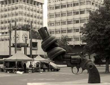 Sculpture of a handgun with barrel tied in a knot.