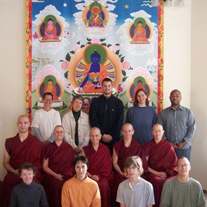 The 2008 Exploring Monastic Life participants pose in front of the beautiful Medicine Buddha thangka in the Abbey living room.
