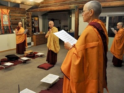 Venerable Chodron and other monastics in the meditation hall during the 2014 Pravarana ceremony.