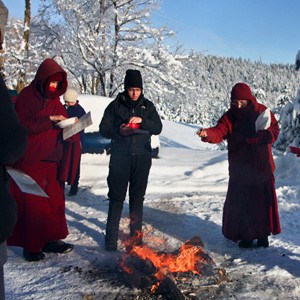 Monastics and layperson participating in dorje khadro ceremony.