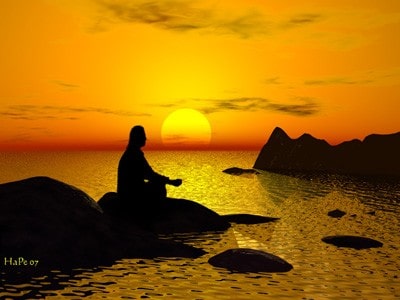 A man meditating on a rock, surrounded by the sea, sunset in the background.