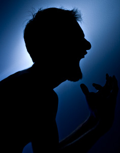 A man shouting angrily