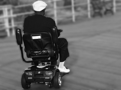 Man in an elelctric wheelchair.