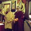 Venerable Chodron and Venerable Tenzin Kacho, standing in front of an altar at Vajrapani Institute in Boulder Creek.