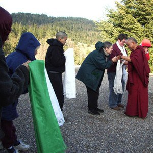 Retreatants offering katas to Lama Thubten Zopa Rinpoche when he arrives at Abbey.