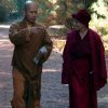 Venerable Chodron and a monk walking down a path, in conversation.
