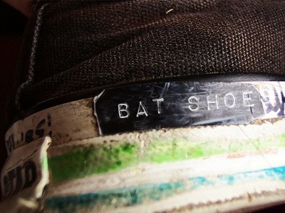 Sneaker with the label 'Bat Shoes' on it.