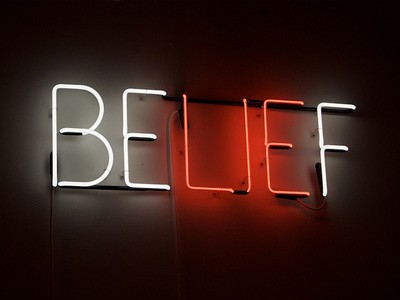 Neon sign of the word belief with lie highlighted.