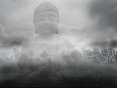 Transparent image of a Buddha transposed over a landscape with mountains and trees.