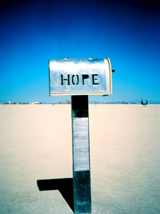 A letterbox with the word HOPE, very clear blue sky in the background.