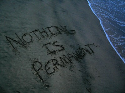 Someone wrote the words Nothing is permanent on the sand.