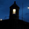 Silhouette of guard station atop Oregon State Penitentiary.