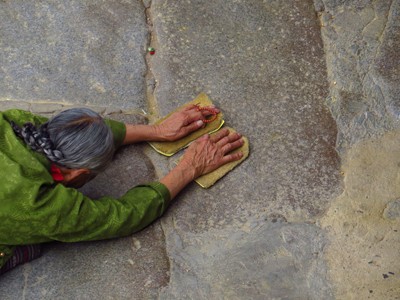 A woman prostrating.