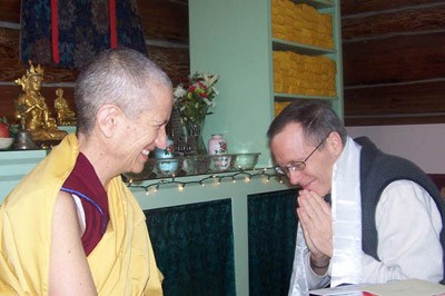 Kevin kneeling in respect to Venerable Chodron.