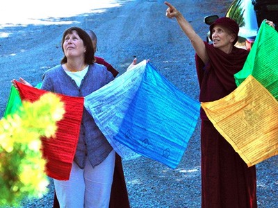 Tracy helping raise prayer flags at the Abbey.
