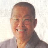 Photo of Venerable Sek Fatt Kuan, smiling.