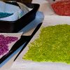 Rice in different colors on a table.