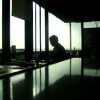 A man working in office facing the window