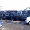 A wall with the word Ethical consumerism is still consumerism.