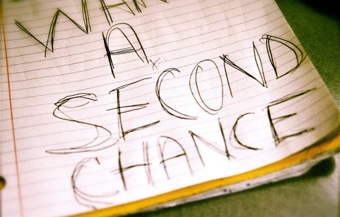 Big writing on a notebook page "what a second chance